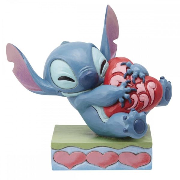 *Figura enesco disney stitch abrazando un corazón