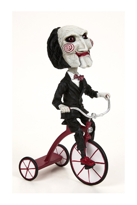 *Figura neca saw head knocker puppet on tricyclesue)